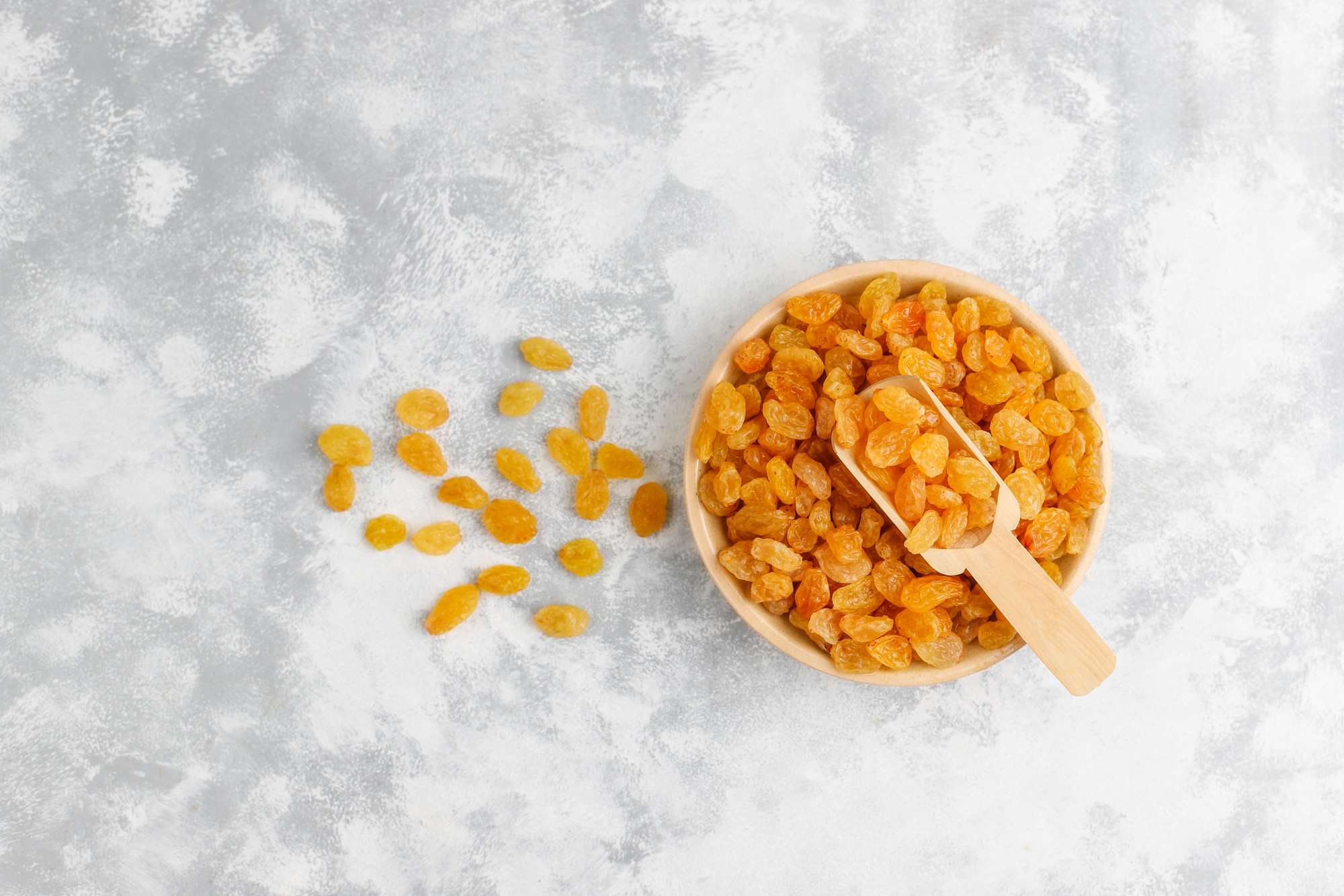 Golden raisins with a bright yellow color, plump and juicy appearance