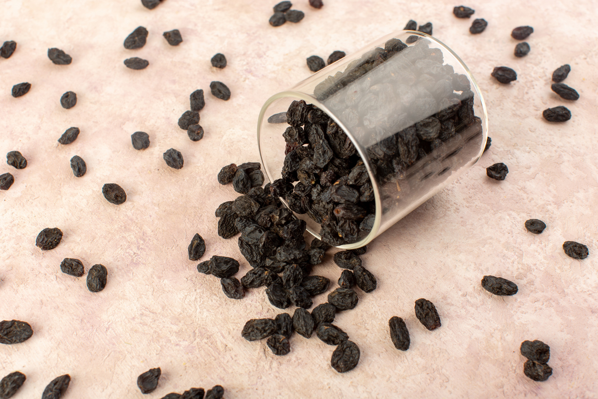 Close-up of black raisins, showing their dark brown color and wrinkled texture