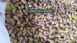 Premium, elongated Akbari pistachio kernels with a vibrant green color, used in high-end products.
